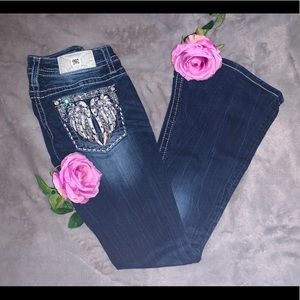 Low rise Miss Me dark wash jeans.